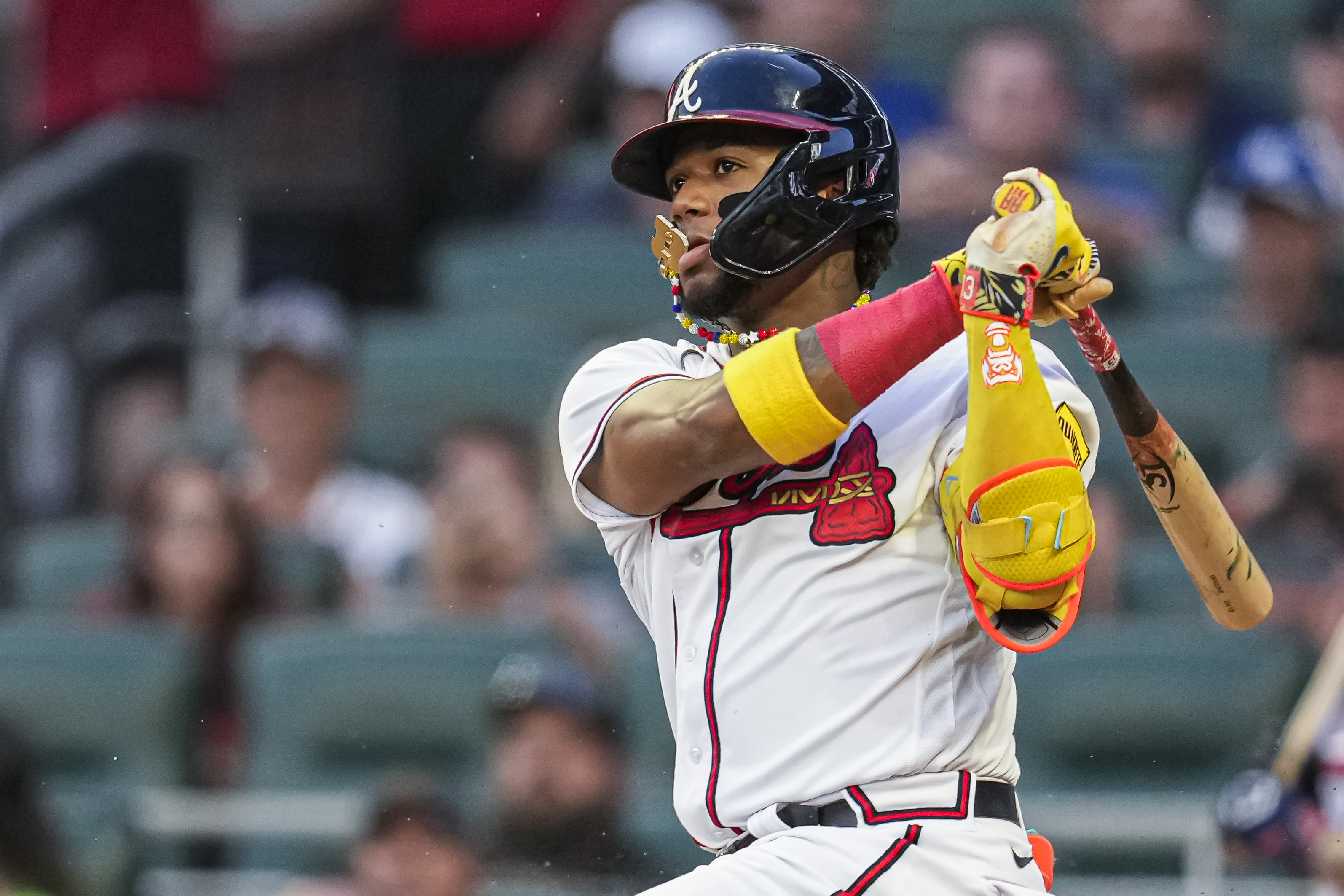 Aug 23, 2023; Cumberland, Georgia, USA; Atlanta Braves right fielder Ronald Acuna Jr. (13) gets an infield single against the New York Mets during the second inning at Truist Park. Mandatory Credit: Dale Zanine-USA TODAY Sports  